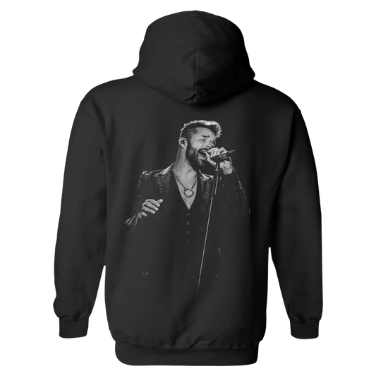 Black hoodie with a graphic of a man singing on the back, on a white background